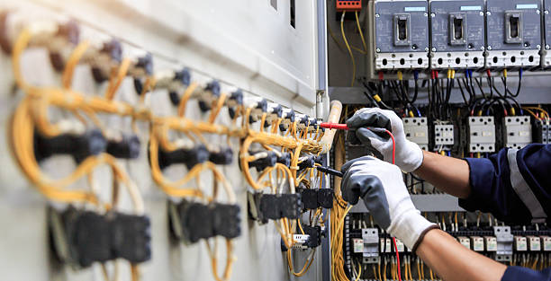 Professional Electrician technician working in Woodlawn Beach, FL